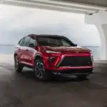 Red Buick Enclave parked under underpass