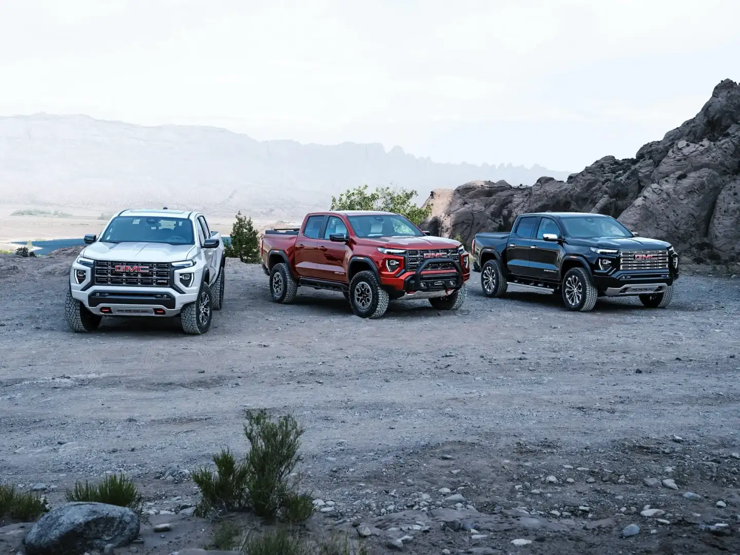Line up of GMC Canyon Trucks on a mountain