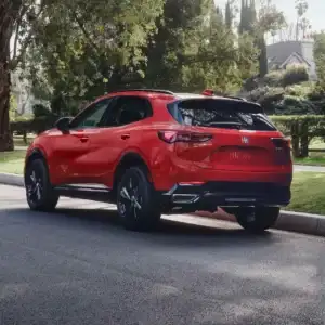 2026 Buick Envision Brilliant Red parked on the side of a road