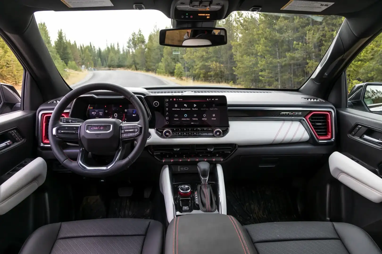 GMC Canyon interior view of the driver and passenger seats and media console