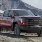 GMC Sierra 1500 off roading on a mountain dirt road