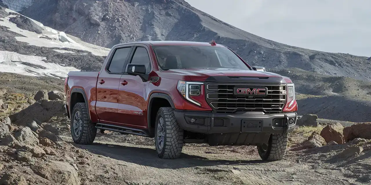 GMC Sierra 1500 off roading on a mountain dirt road