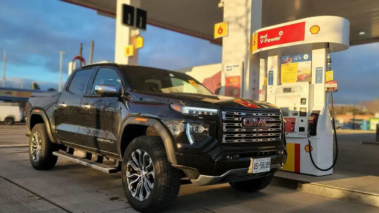 Black GMC Canyon Denali parked at a Shell Gas Station