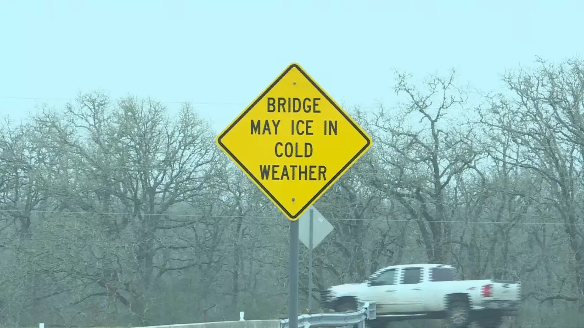 Road sign with bridge warning