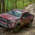 2023 GMC Canyon AT4X driving in mud