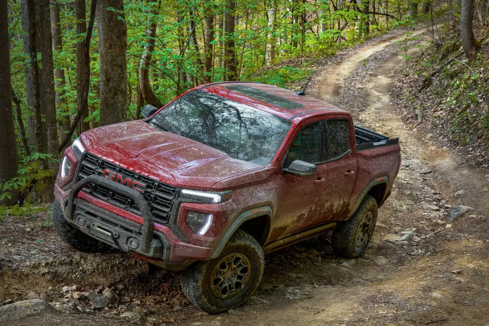 2023 GMC Canyon AT4X driving in mud