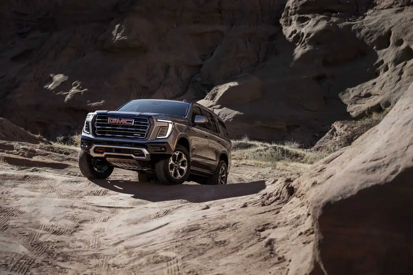 GMC Yukon AT4 Ultimate off road on a dirt road