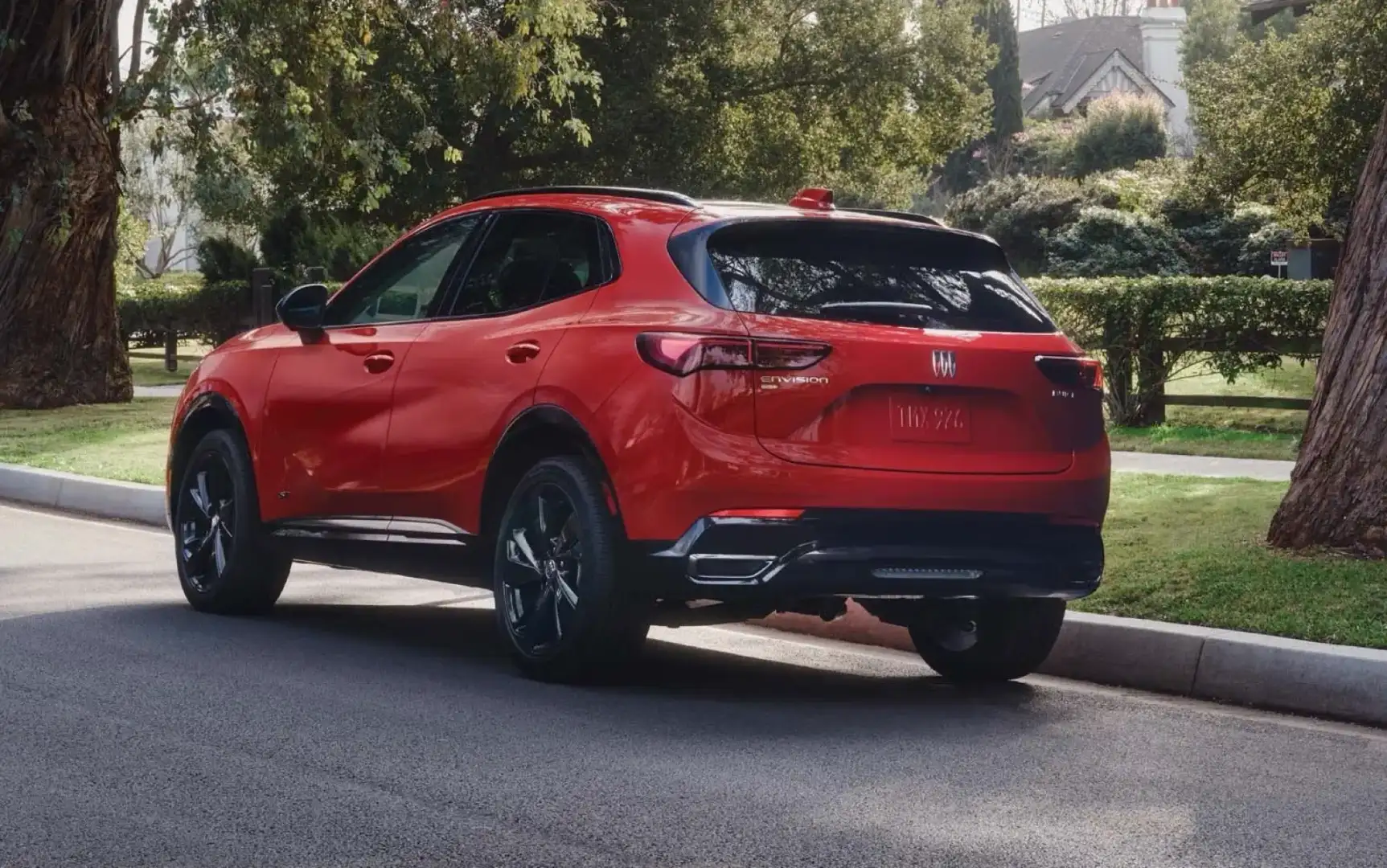 2026 Buick Envision red in a neighborhood