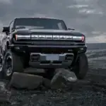 2025 GMC HUMMER EV front view rocky terrain