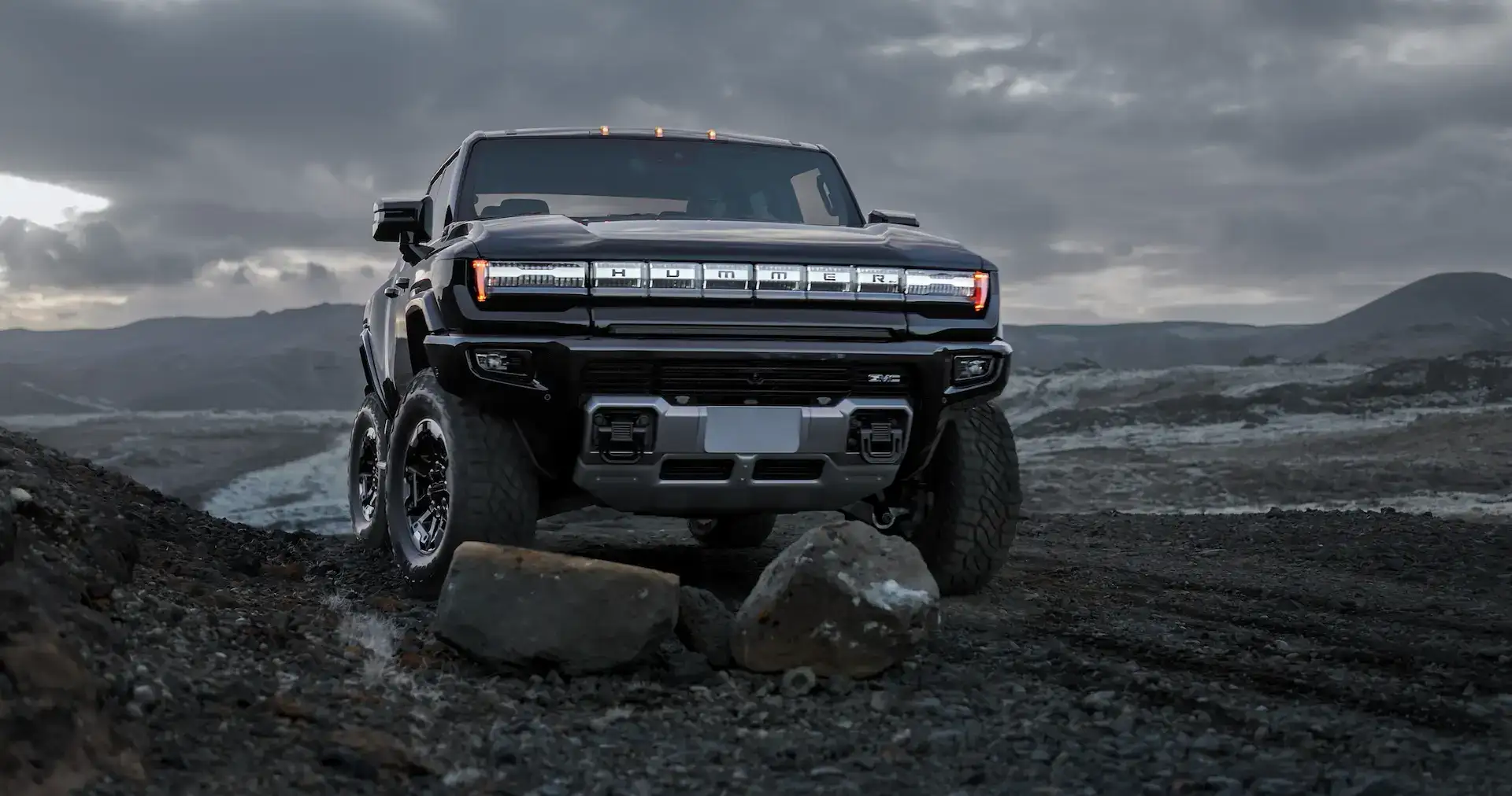 2025 GMC HUMMER EV front view rocky terrain