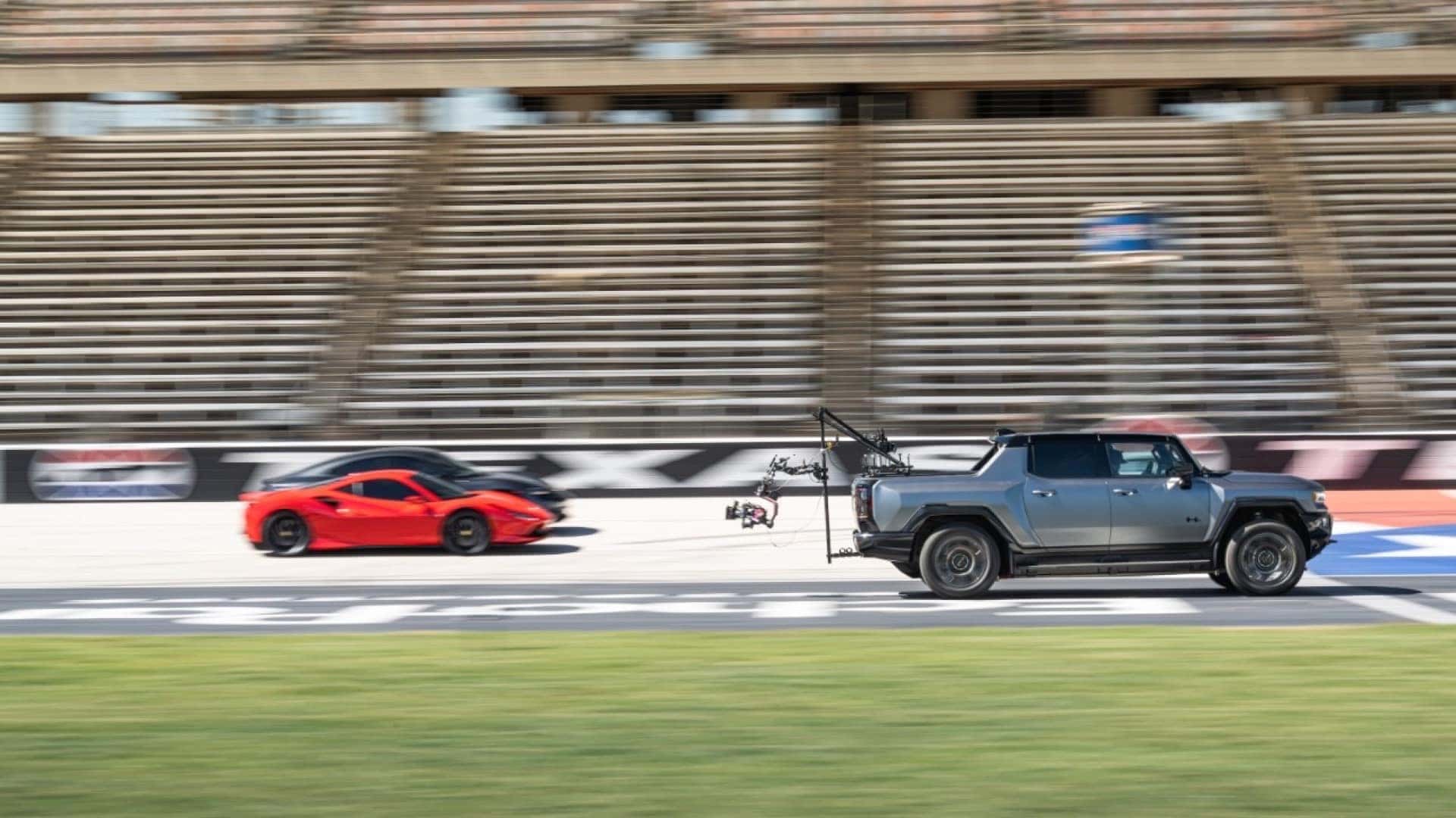GMC Hummer Races Supercars