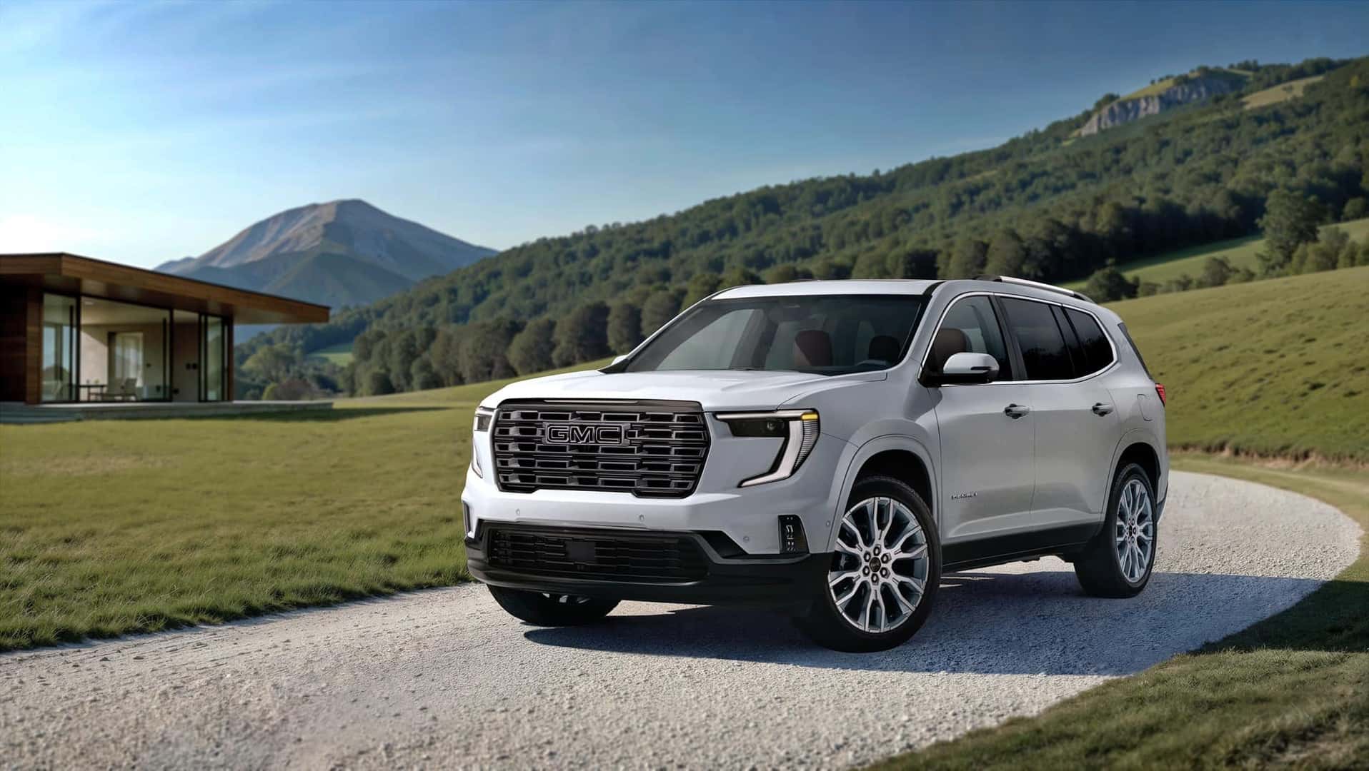2026 GMC Acadia Denali Ultimate Driver Side View Driving