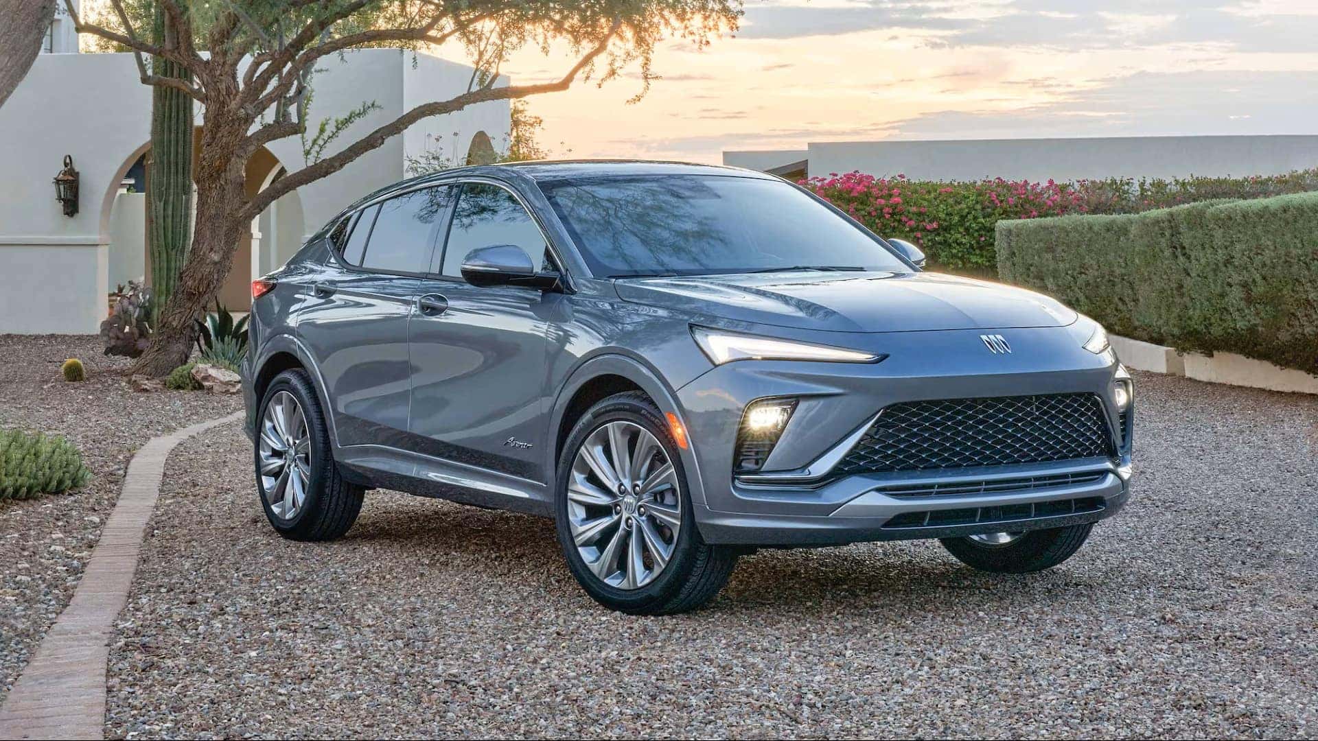 The Affordable And Budget-Friendly 2026 Buick Envista, Parked Outside A Beautiful Family Home With A Large Tree In Front