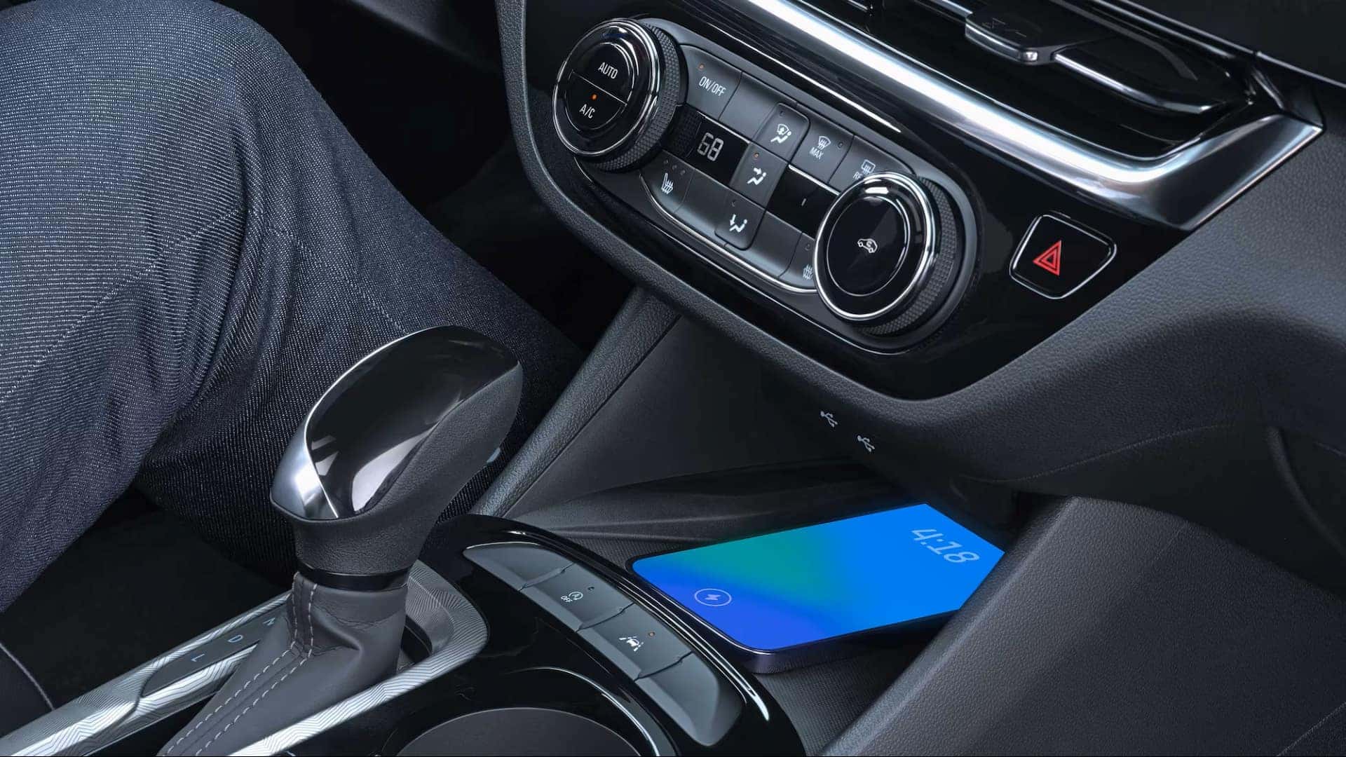 A Phone Charging Under The Front Console Of The Technologically Advanced Buick Envista