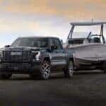 2027 GMC Sierra Denali Ultimate Towing a Boat