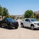 2026 GMC Sierra 1500 AT4 and Denali side by side in Plano, TX