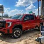 2026 GMC Sierra 2500 HD loaded with contractor equipment at a Plano, TX jobsite