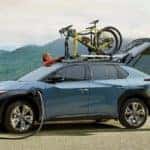2023 Subaru Solterra Exterior Driver Side Front Profile while Charging