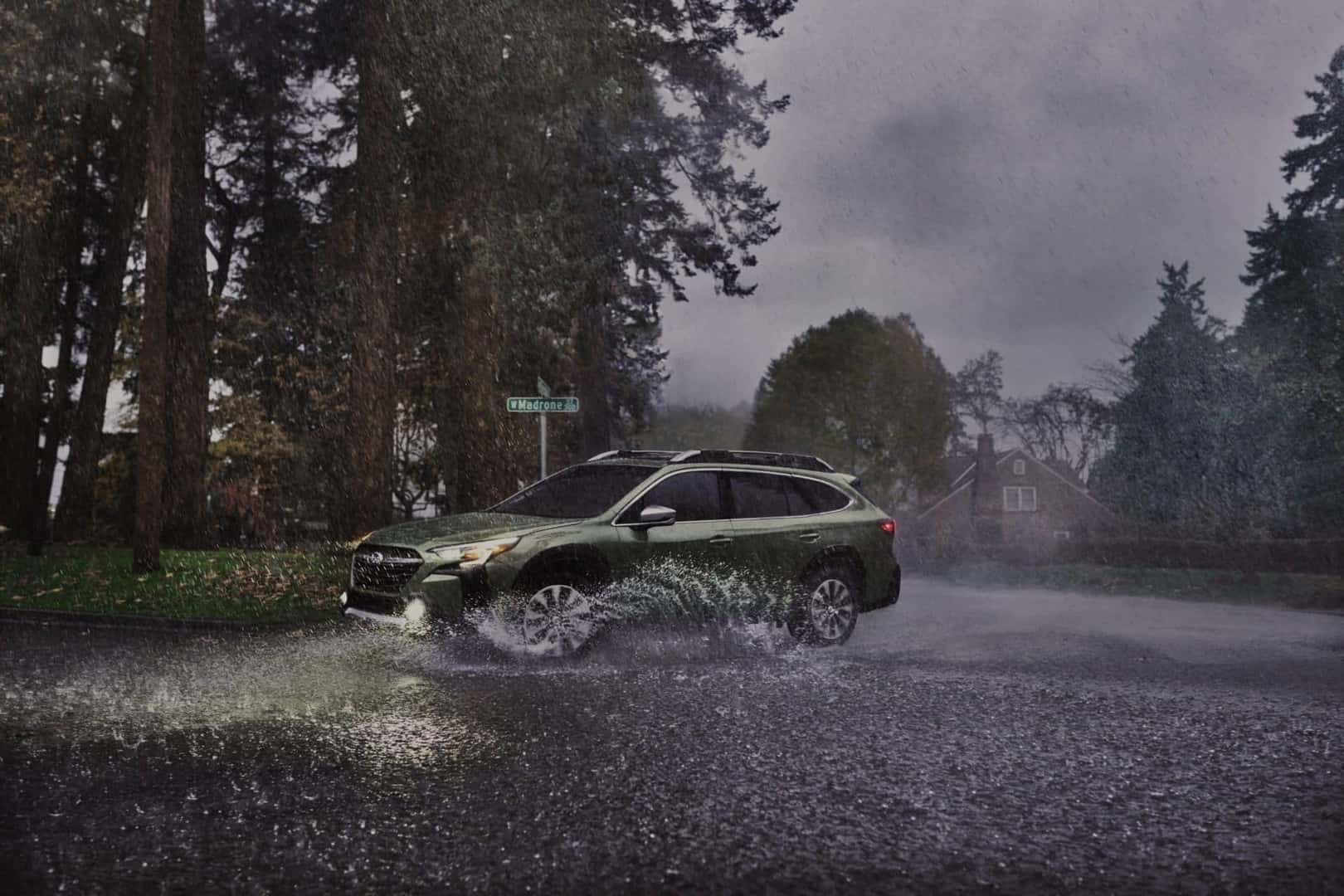Pelting Rain Soaks The Road As The Perseverant Subaru Outback Drives With Ease