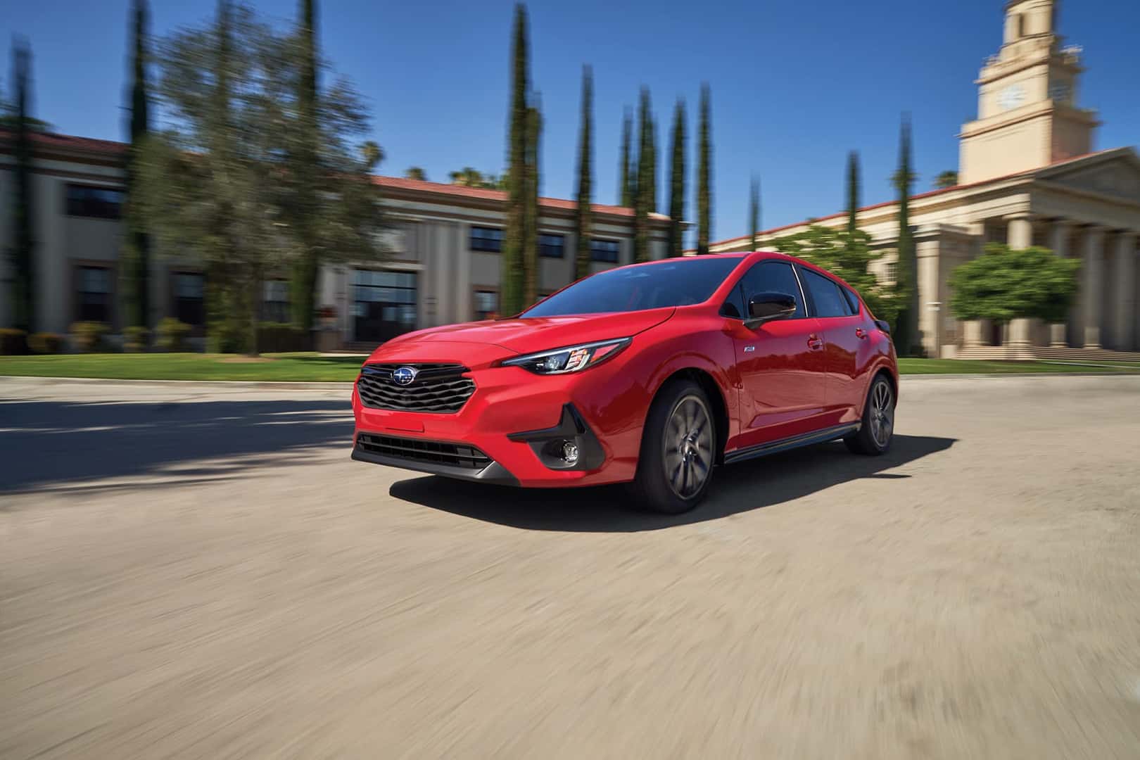 2026 Subaru Impreza Pure Red in motion