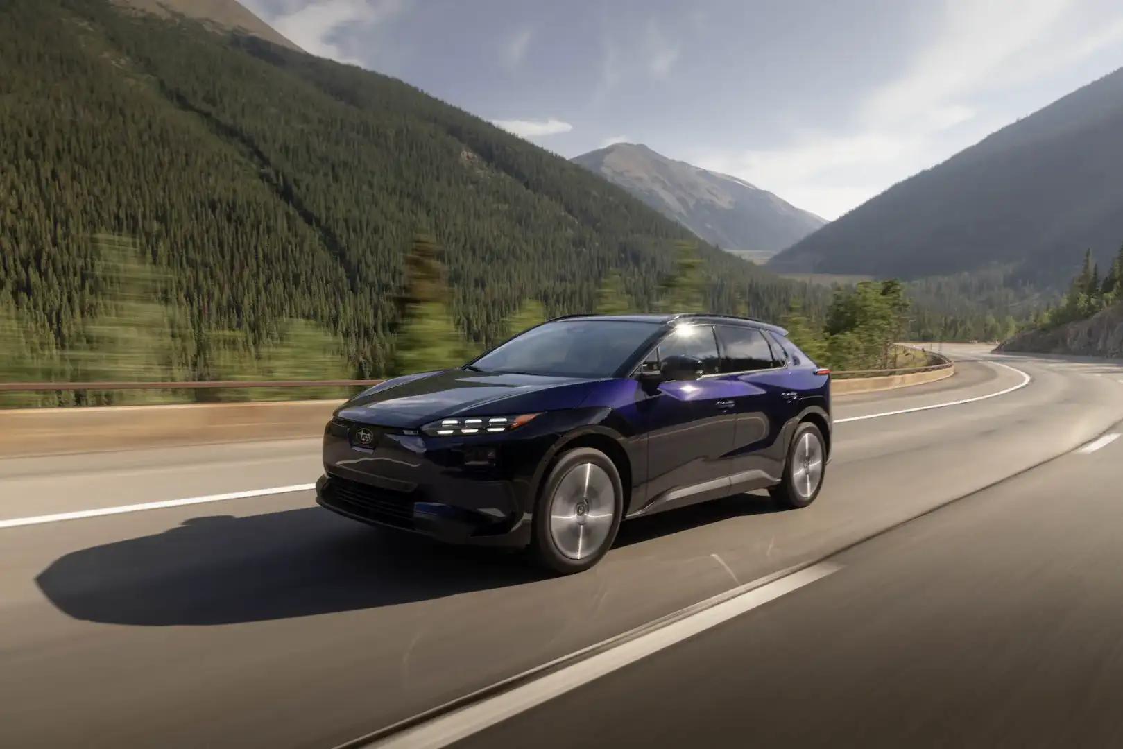 2026 Blue Subaru Solterra Driving through mountains