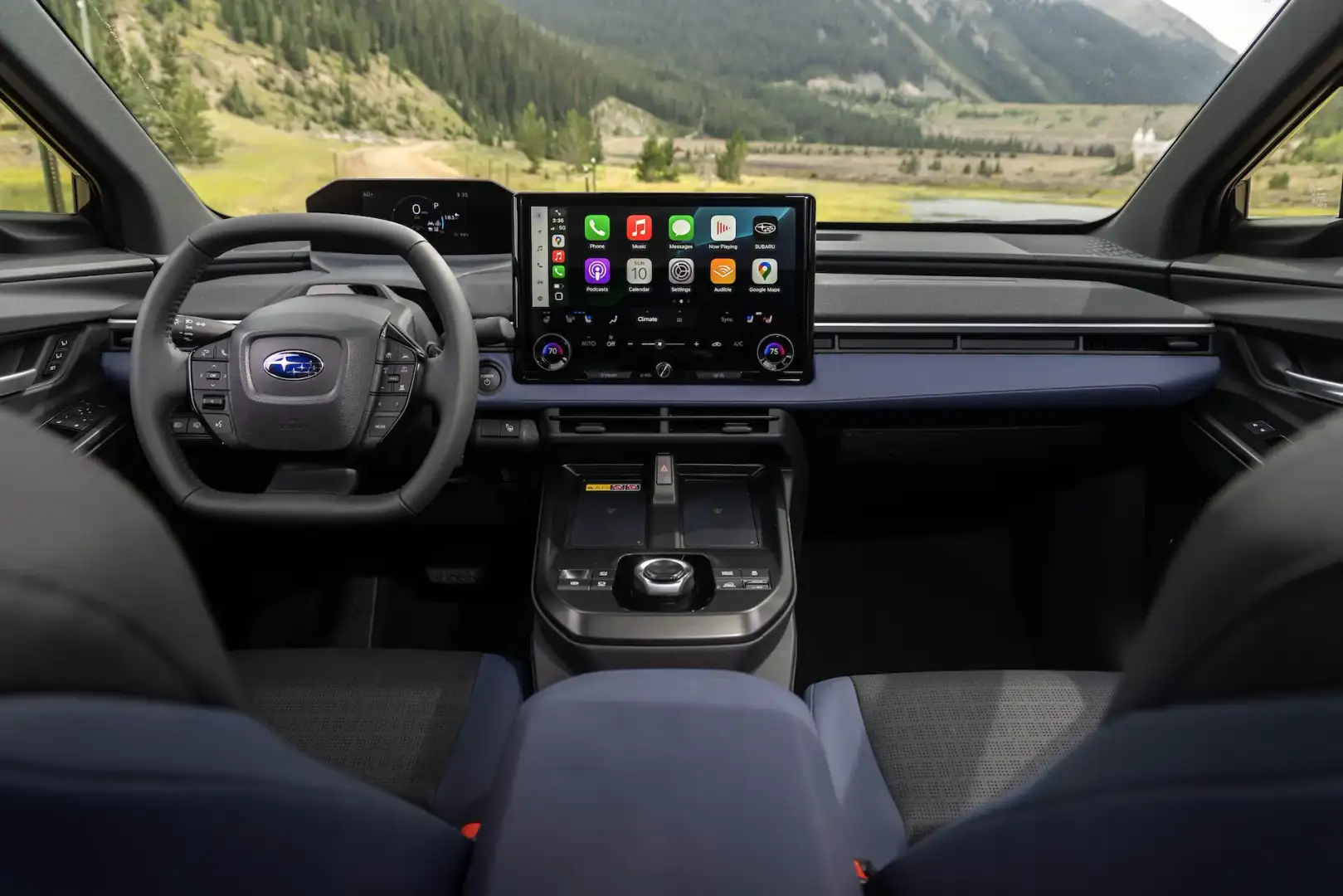 2026 Subaru Solterra interior of the front seats view from behind the drivers seat looking forward