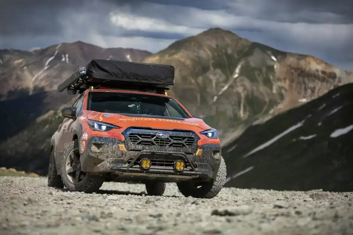 2025 Subaru Crosstrek modified for TransAmerica drive parked off road in front of mountains