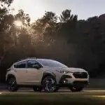 2026 white Subaru Crosstrek Hybrid view of the front parked on grass in a park