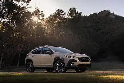 2026 white Subaru Crosstrek Hybrid view of the front parked on grass in a park