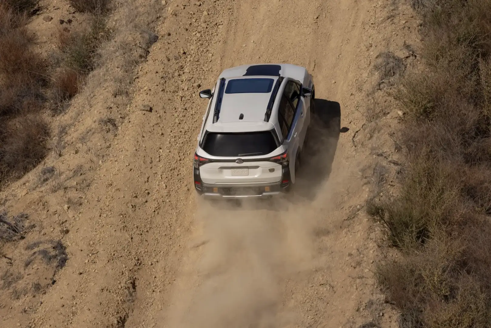 Offroad view of the top of the 2026 Subaru Forester Wilderness driving on a dirt road