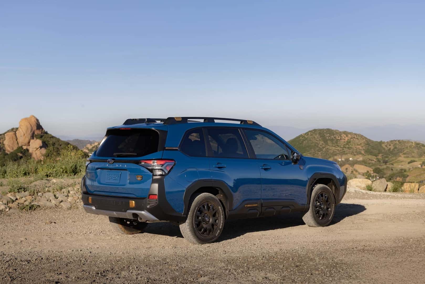 2027 Subaru Forester Wilderness Hybrid Passenger Side View in Desert