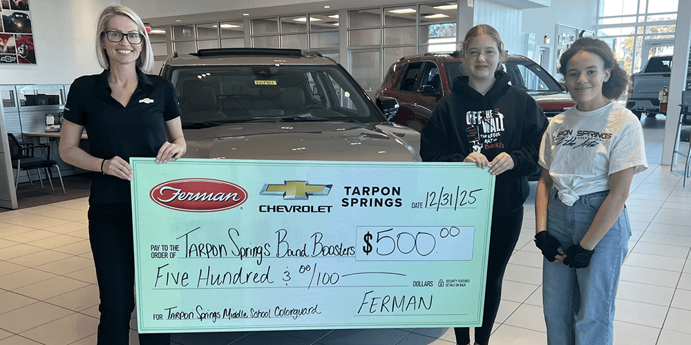 Image of Tarpon Springs Dealership donating to Band Boosters
