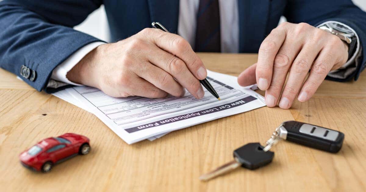 Signing Driver Paperwork How Long Does it Take to Order a Car? I Five Star Automotive Group