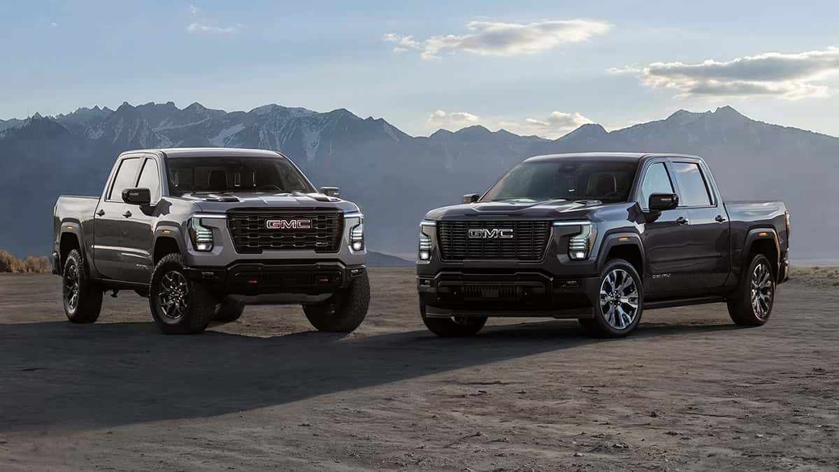 Two GMC Trucks Side by Side