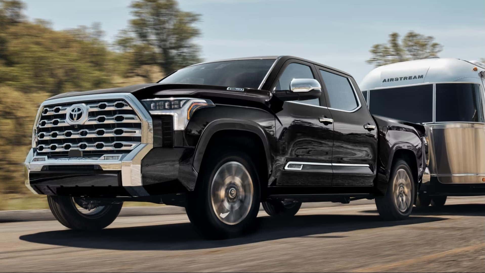 Black 2026 Toyota Tundra Towing Airstream Camper Near Houston, TX