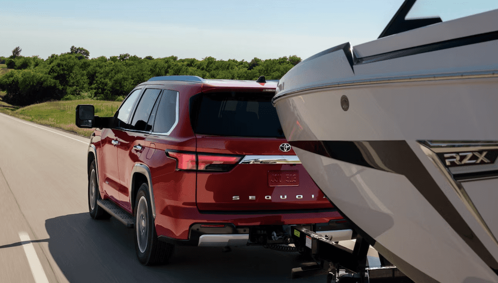 Red 2026 Toyota Sequoia towing boat Near Conroe, TX