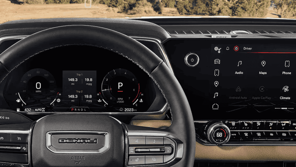 2026 GMC Canyon Denali dashboard near Ruth NC with Denali steering wheel and touchscreen infotainment