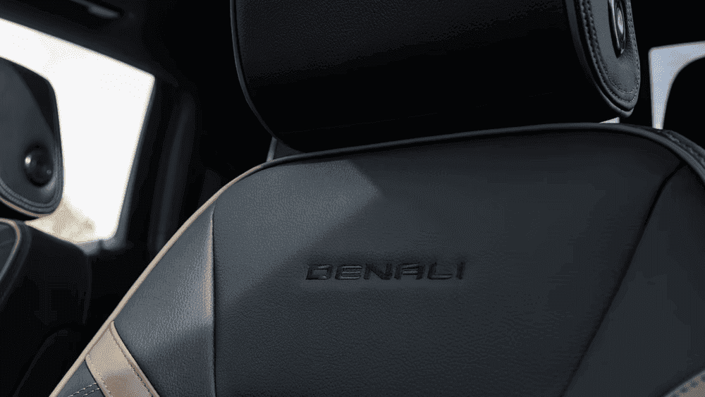 2026 GMC Canyon Denali black leather seat near Ruth NC with embossed Denali logo and tan contrast trim