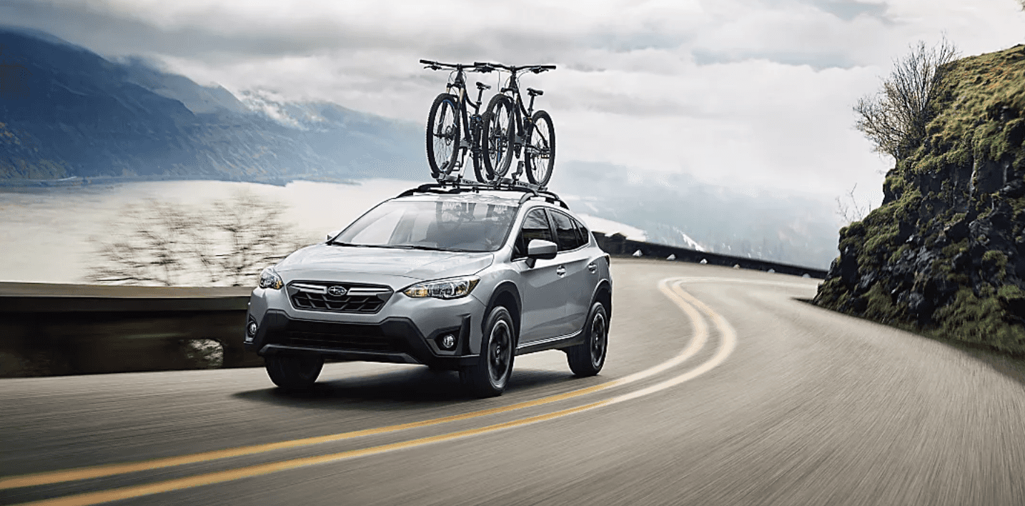 Subaru Crosstrek - exterior silver on rode with bike