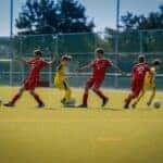 group of men playing soccer during daytime by Omar Ram is licensed with Unsplash License