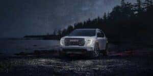 2025 GMC Acadia outdoors at night