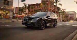 2025 Subaru Ascent driving through a city