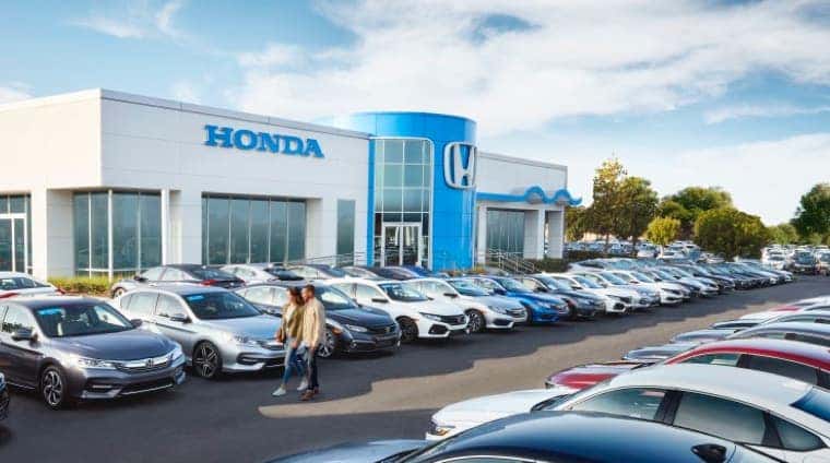 The Honda Certified Pre-Owned logo is shown above a white sedan and a blue hatchback.