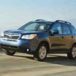 blue subaru on road