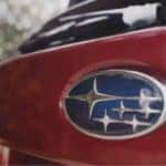red subaru and logo