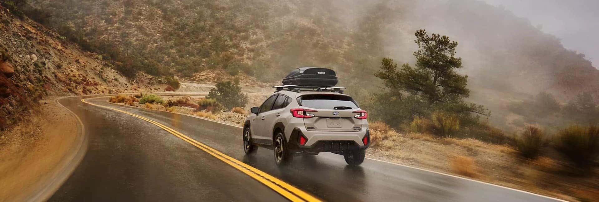 Subaru Crosstrek Hybrid Driving Down Winding Mountain Highway