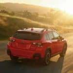 2022 Subaru Crosstrek driving on a country road into the sunset_mobile