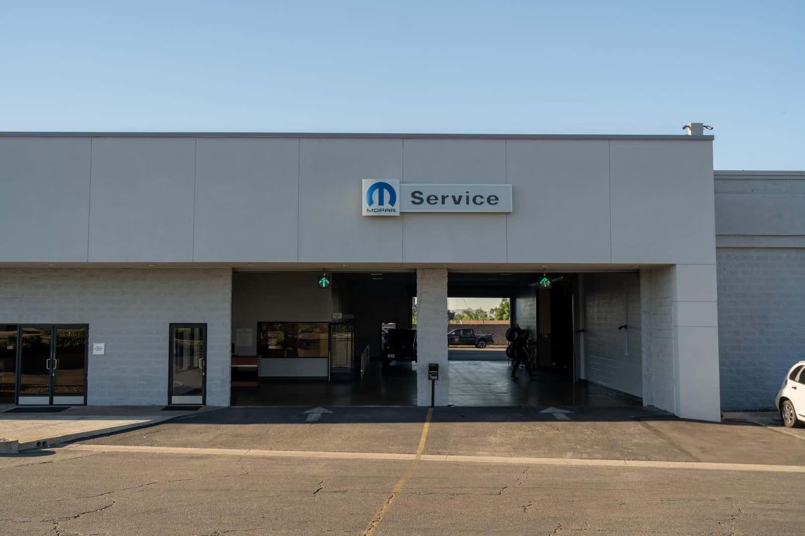 The Mopar Service drive entrance at Knight Claremont Chrysler Dodge Jeep Ram on Auto Center Drive