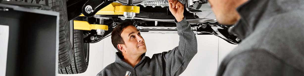 Land Rover mechanic inspecting vehicle