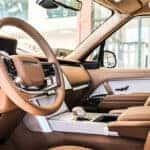 2025 Range Rover Sport interior showcasing advanced technology features, including a digital display, premium controls, and intuitive infotainment system.